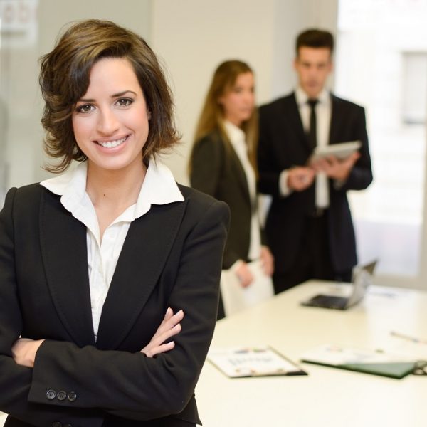 Business leader looking at camera in working environment